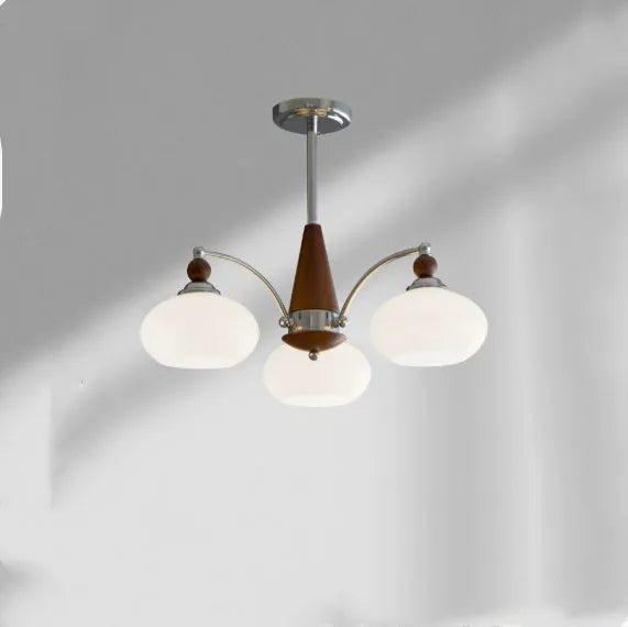 Creative persimmon glass chandelier with chrome frame and multiple glass shades in milky white or cream yellow.