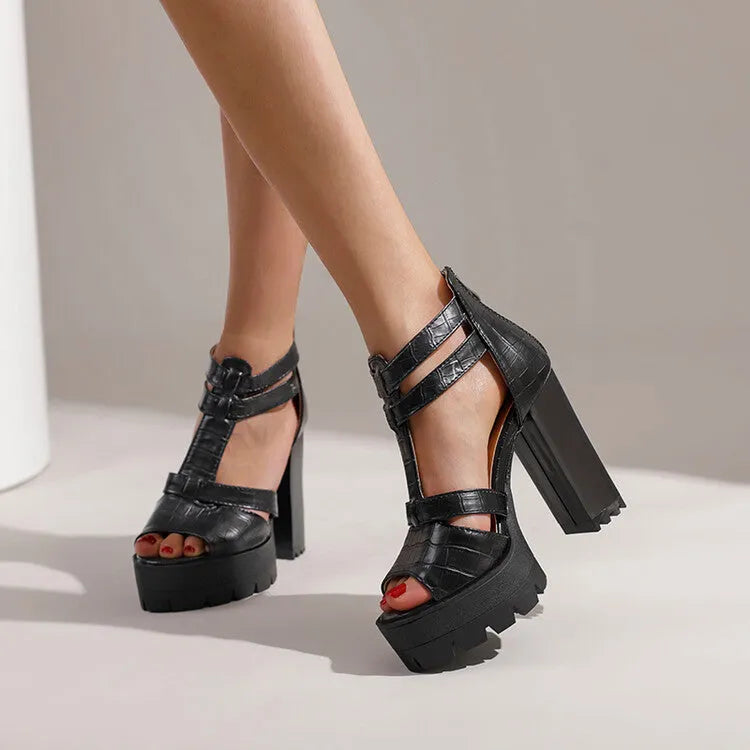 Women's black platform high heel sandals with a round toe and a back zipper fastening.