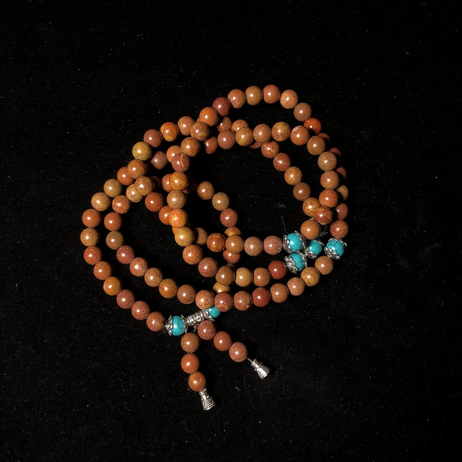 Stone bracelet with 108 hand-polished geometric beads measuring 5-6mm diameter