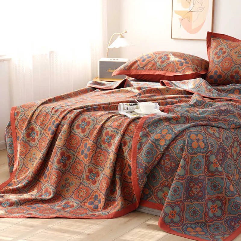 Cotton gauze bed blanket set with floral patterns showing blanket and two pillowcases