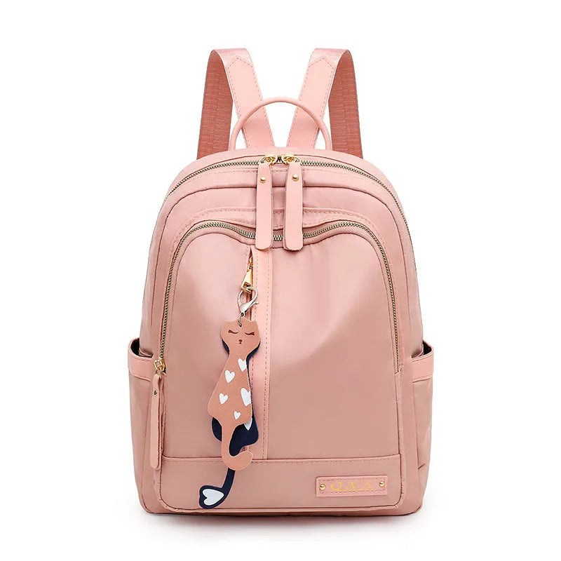 Women's casual nylon backpack in black or pink with square shape, showing external pocket and double straps.