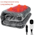 Grey 12V car electric blanket plugged into a vehicle cigarette lighter socket.