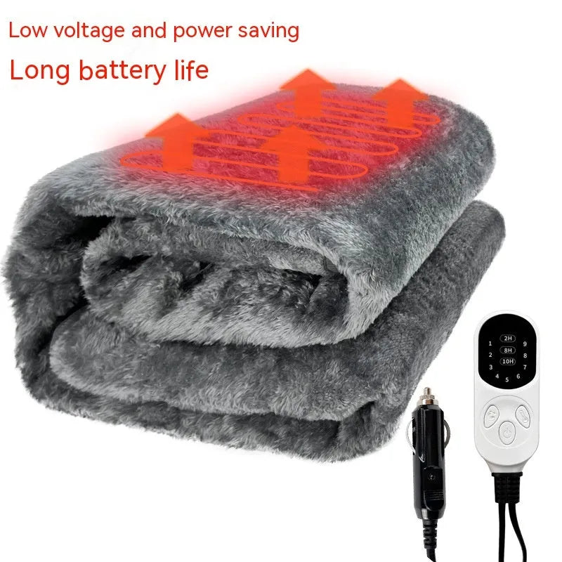 Grey 12V car electric blanket plugged into a vehicle cigarette lighter socket.