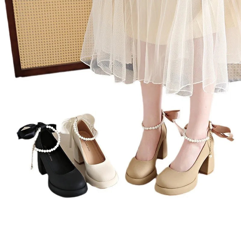 Women's beige Mary Jane shoes with a chunky heel, round toe, and a buckle fastening on the ankle strap.