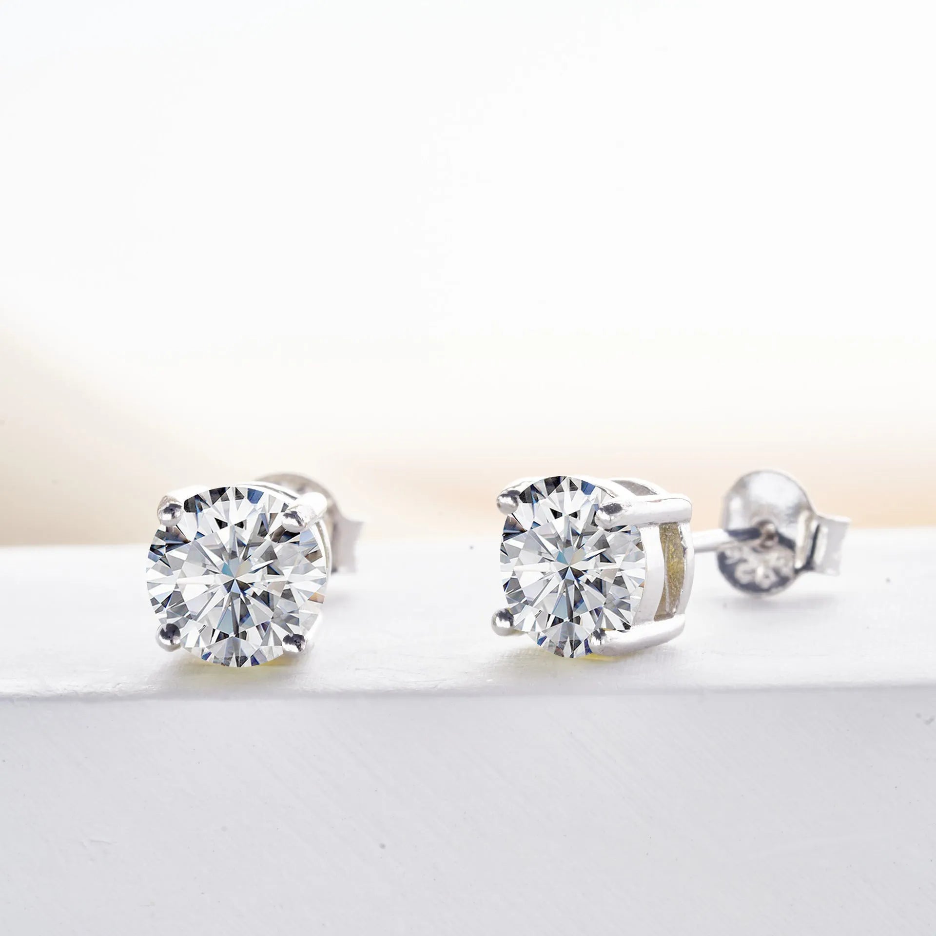 Micro inlaid moissanite stud earrings in S925 sterling silver with round natural stones, unisex design, 1CT per pair