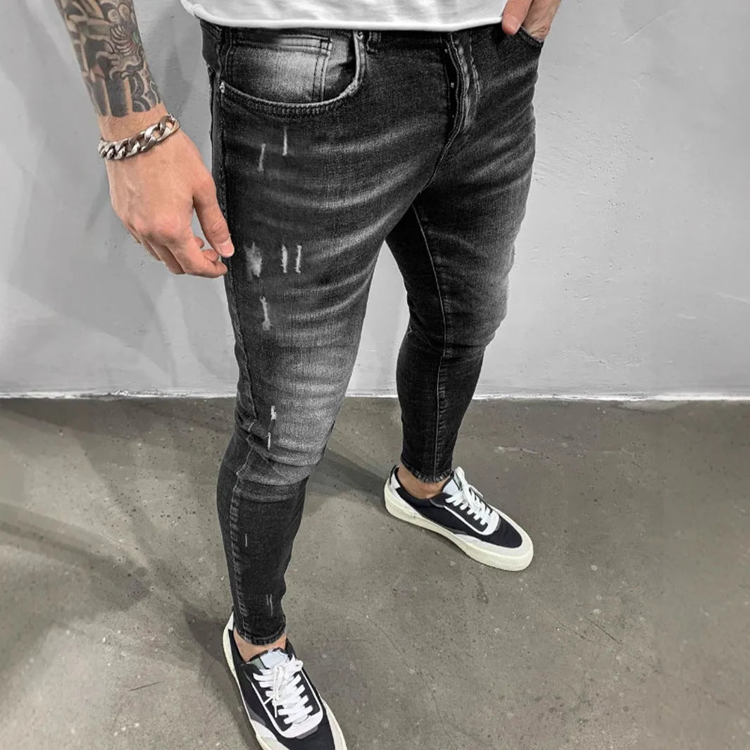 Gray ripped denim skinny pants for teenagers, cotton fabric, mid waist, zip fly, front view