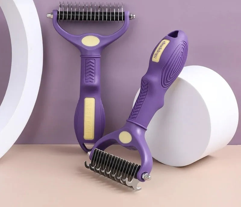 Purple double-sided plastic dog comb for grooming and untying knots, showing ergonomic handle.