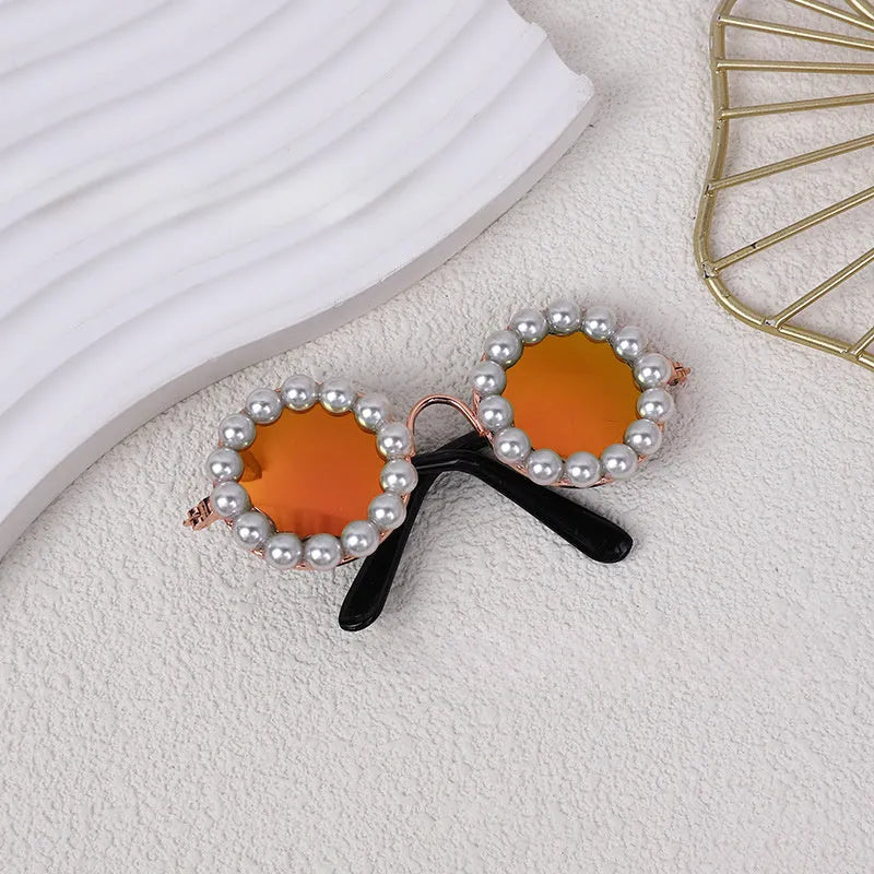 Pearl-rimmed round sunglasses for pets on cat and dog with black, blue, coffee, orange and purple colour options
