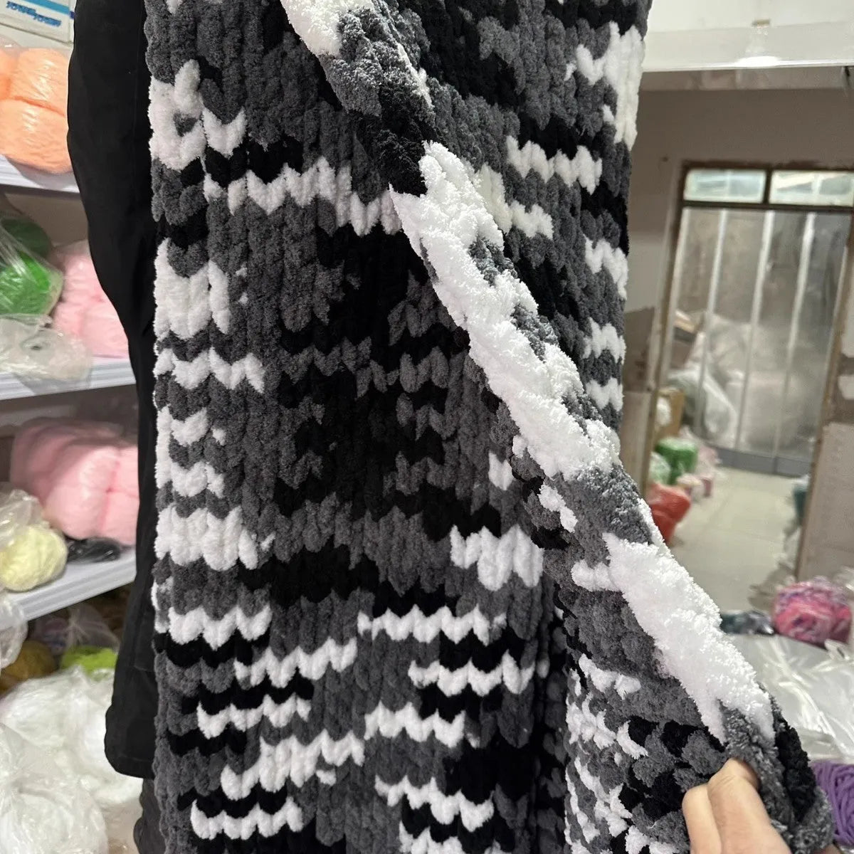 Coarse yarn chenille knitted blanket with braided gravity weighting in modern simplicity styling