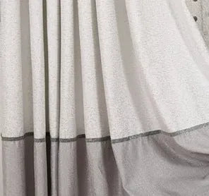 Single blackout curtain panel showing hook heading style with blackout lining visible at edge