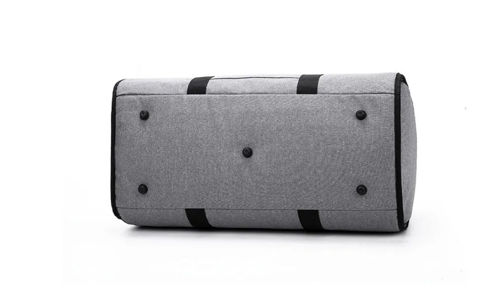 Medium cylinder travel bag in Oxford cloth, shown in black, with zipper open to reveal internal pocket.