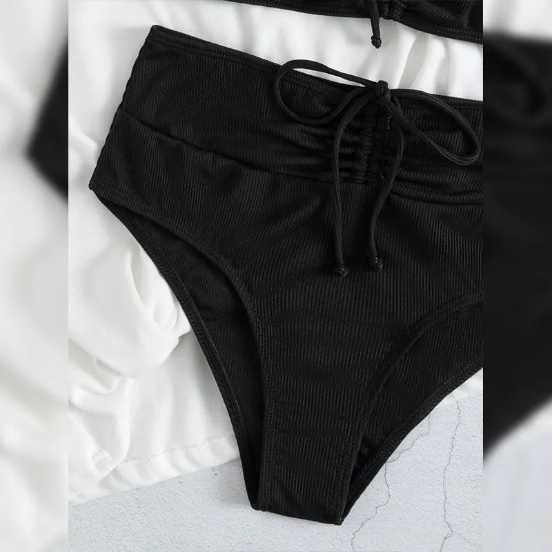 Black women's bikini swimsuit with sling split high waist shorts and sleeveless top