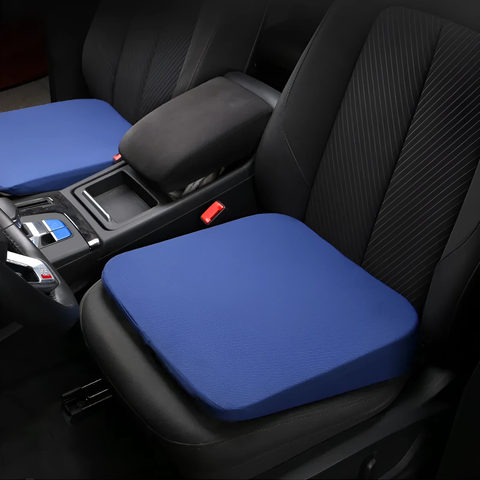 Black car seat cushion for heightening and comfort, shown on a vehicle seat.