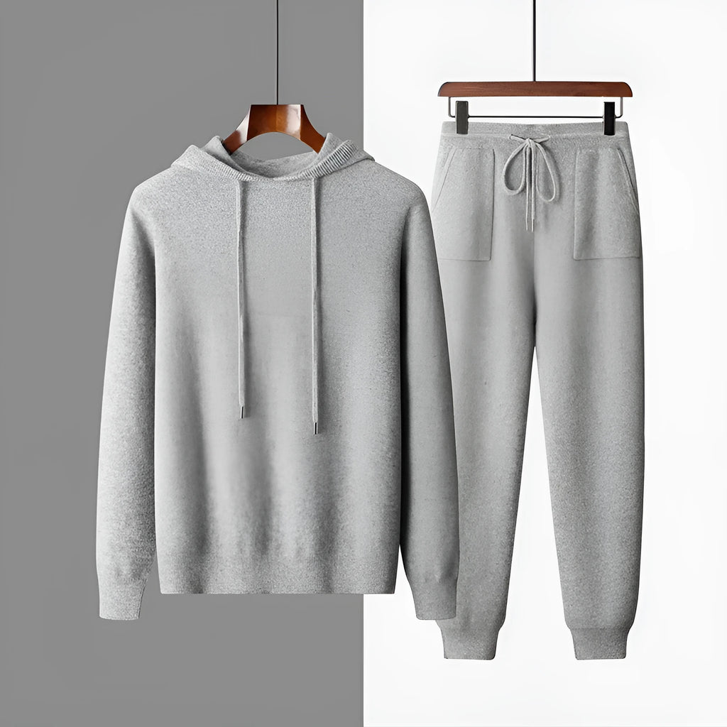 Men's light grey cashmere hooded sweatshirt and matching long pants set laid flat.