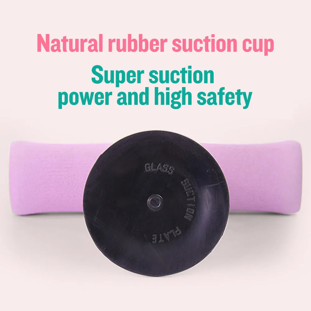 Pink adjustable sit-up bar floor assistant with foam pad and suction base on smooth floor