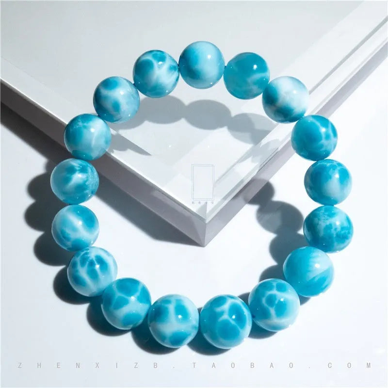 Blue handmade bodhi bracelet with natural crystal sea-pattern stone and pearl beads in Maillard style.