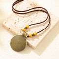 Alloy cowhide string ethnic pendant necklace with geometric auspicious pattern, 20CM drop, unisex Chinese style, bronze coffee beads