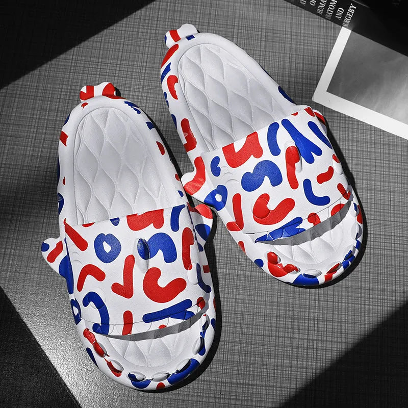 Beige and black EVA open-toe home slippers with a shark design on the front, shown as a couple's pair.