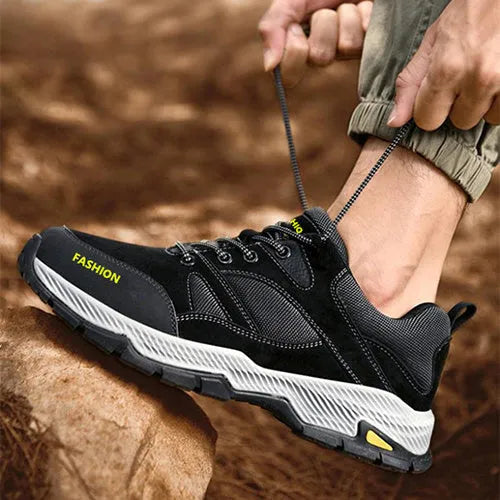 Men's black lace-up sneakers with flyknit upper, round toe, and flat sole