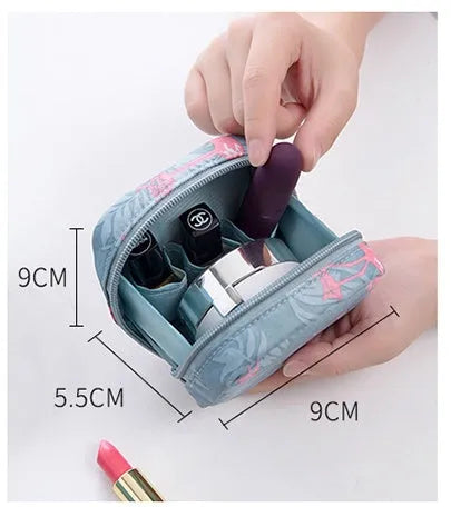 Cloth fabric cube-shaped makeup storage bag in blue, pink, white, and pink/white colour options.