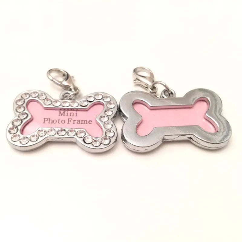 Pink metal dog pendant necklace with bone pattern diamond charm on display