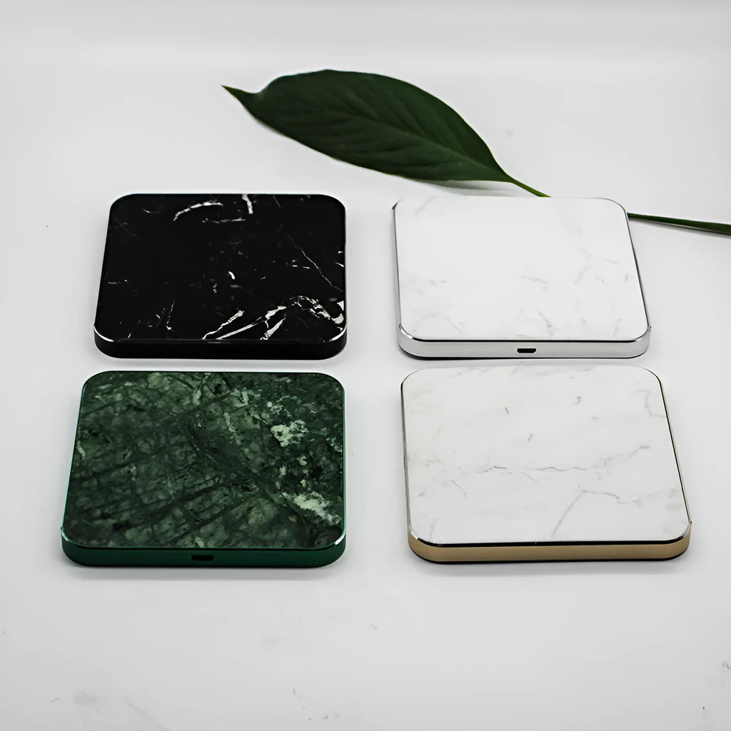 Real marble wireless charger on a desk with indicator light showing blue charging status
