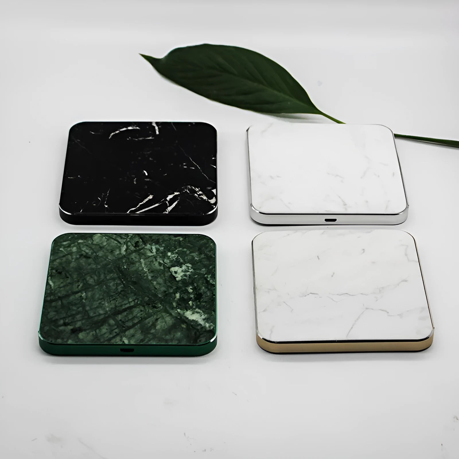 Real marble wireless charger on a desk with indicator light showing blue charging status