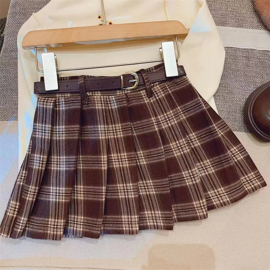 Girls plaid pleated A-line skirt in cotton blend fabric shown in casual setting