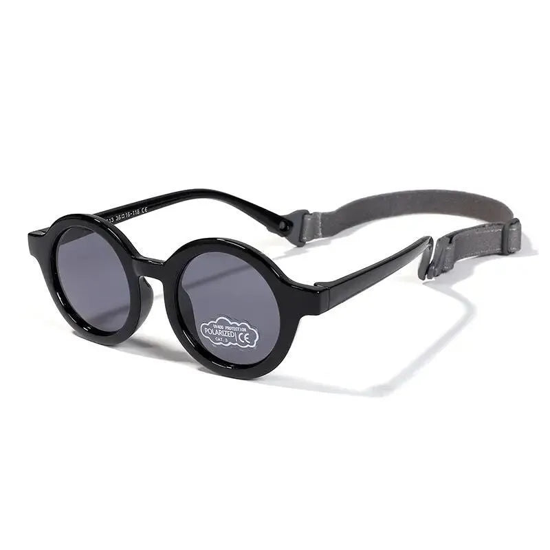 Children's round sunglasses for 0-3 year olds with UV400 protection, shown in a selection of colours.