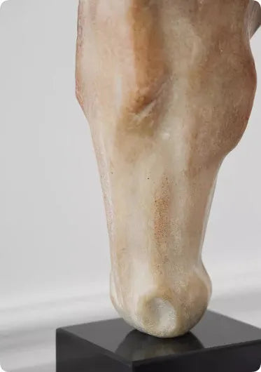 Tall abstract horse head desktop sculpture with a carved finish on a wooden surface.