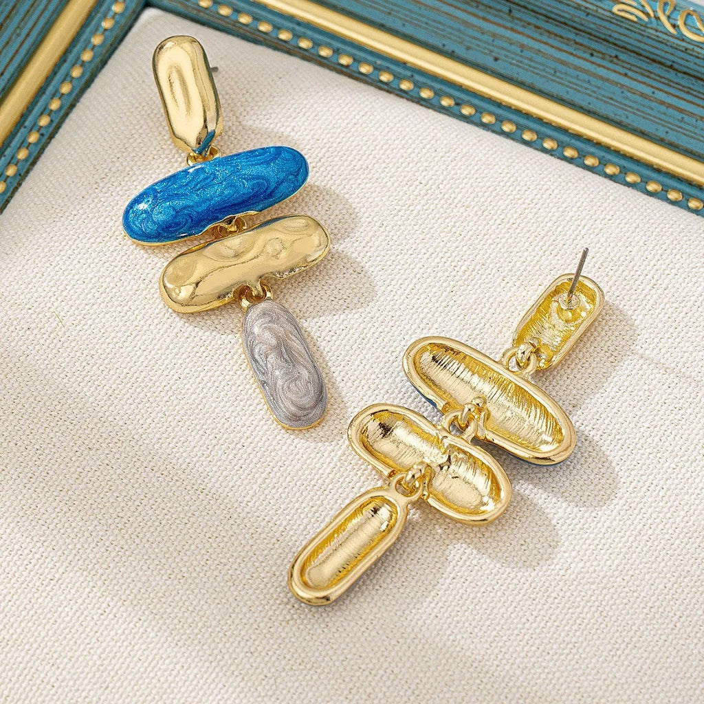 A pair of simple geometric stud earrings with a multicolour electroplated finish.