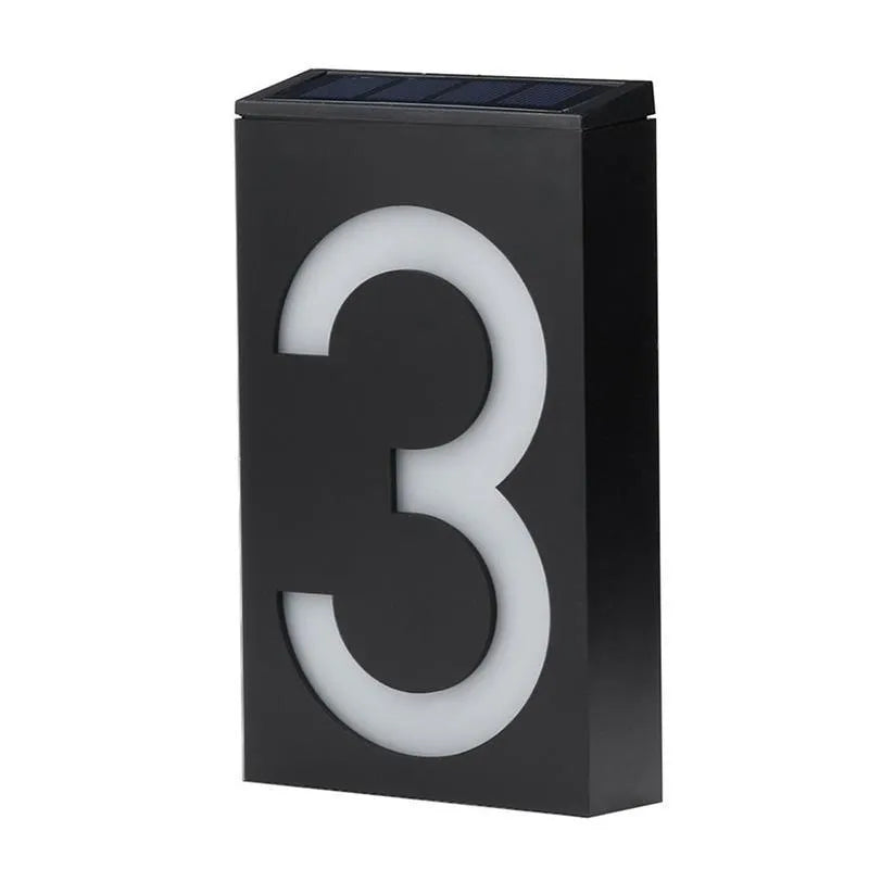 Solar powered outdoor house number light with LED illumination and concealed mounting design