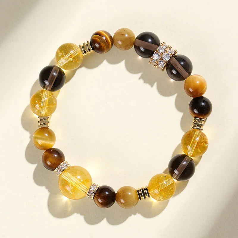 Close-up of a women's bracelet with large 10mm natural yellow artificial crystal beads on a string.