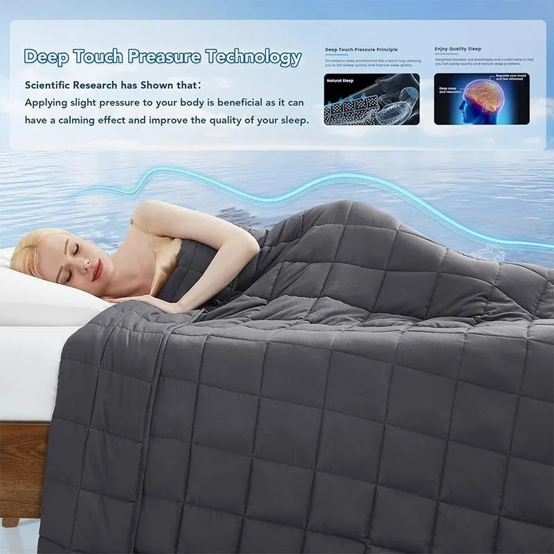 Polyester gravity blanket in solid light grey on bed, 152x203cm size, 12 lb weight option