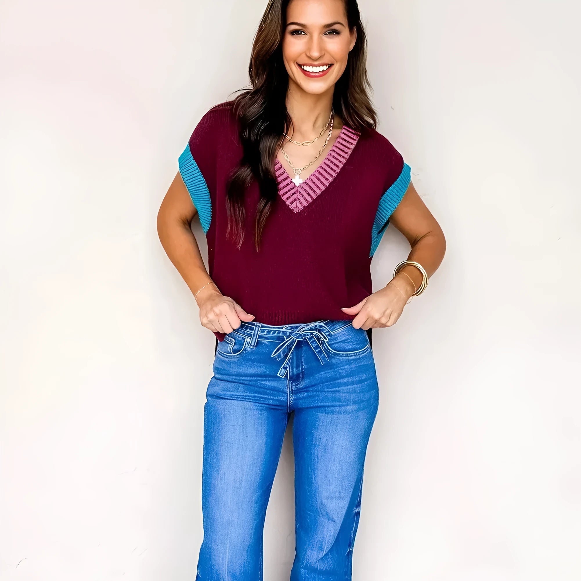Burgundy women's V-neck loose sweater with contrast trim and short cuffed sleeves