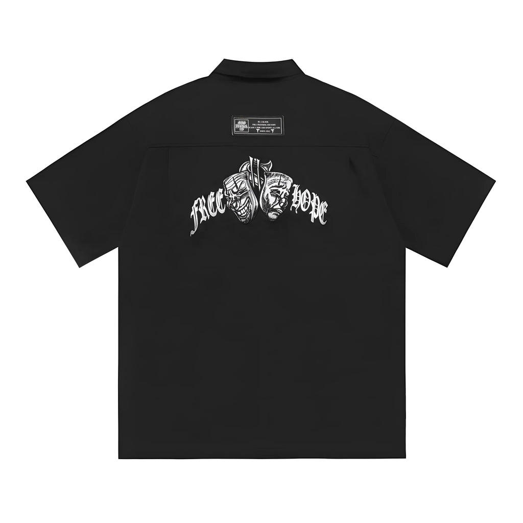 Men's loose black half-sleeve cotton shirt with embroidered chest pocket detail