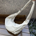 Soft PU large capacity commuter shoulder bag in black, horizontal square shape, with single shoulder strap