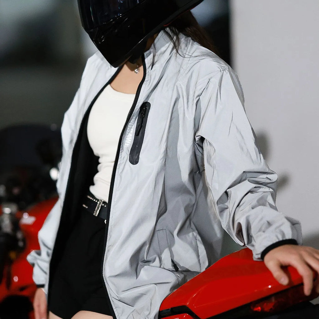 Silver waterproof polyester long sleeved outdoor coat showing windproof features across six European sizes