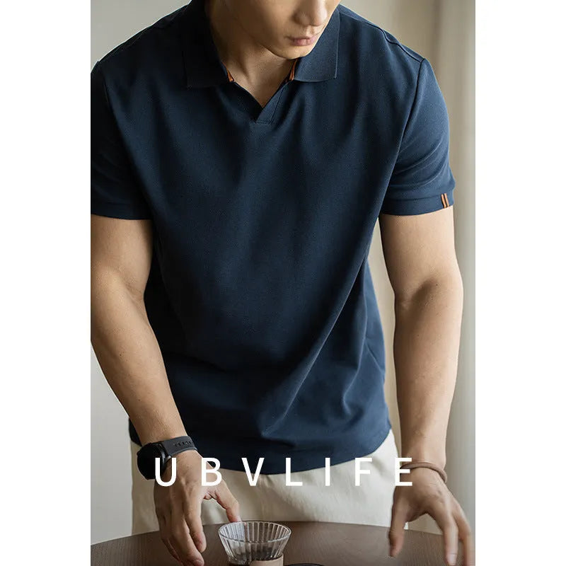 Blue American-style short-sleeved cotton blend polo shirt laid flat, showing regular fit and button placket.