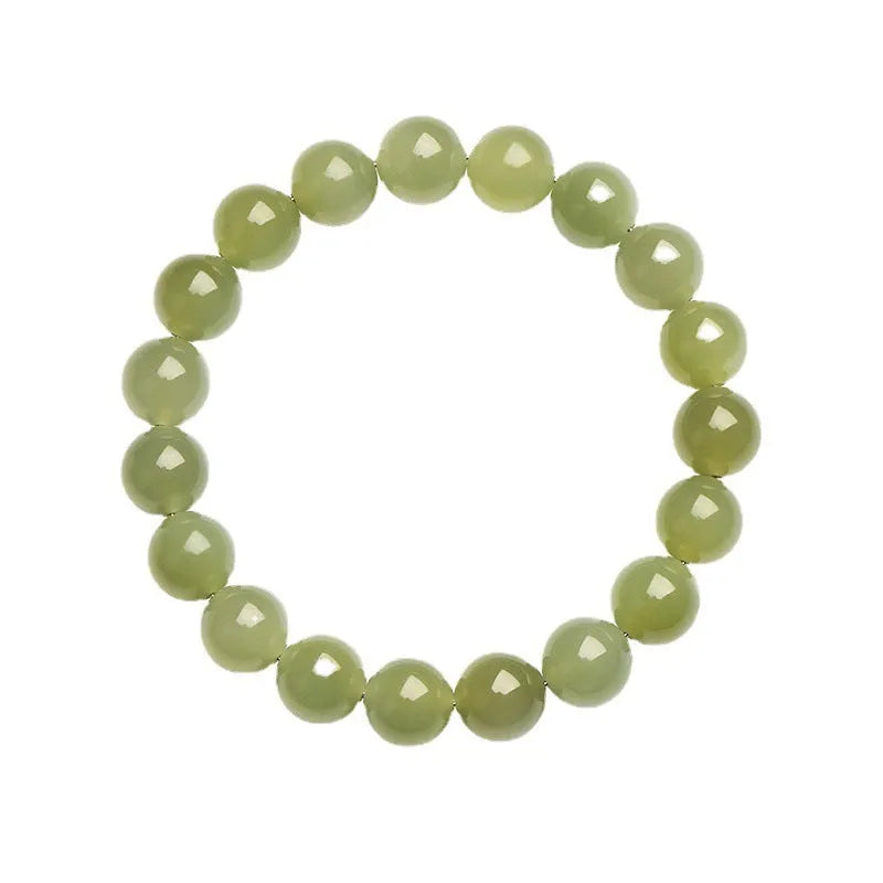 Polished Hetian jade bead bracelet in ice-like clear water colour on a wrist.
