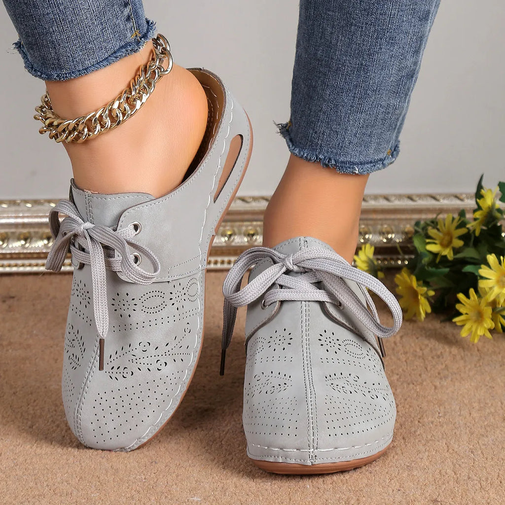 Women's lace-up Baotou slippers with hollow-out wedge design in suede material, available in multiple colours.