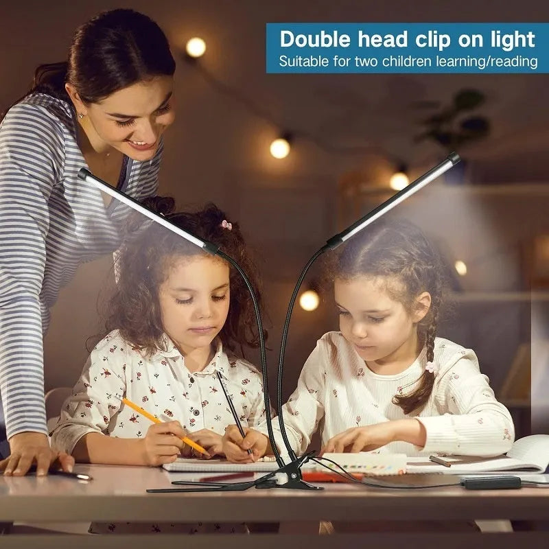 Black and white 26cm USB-powered LED desk lamp on a desk for study lighting.