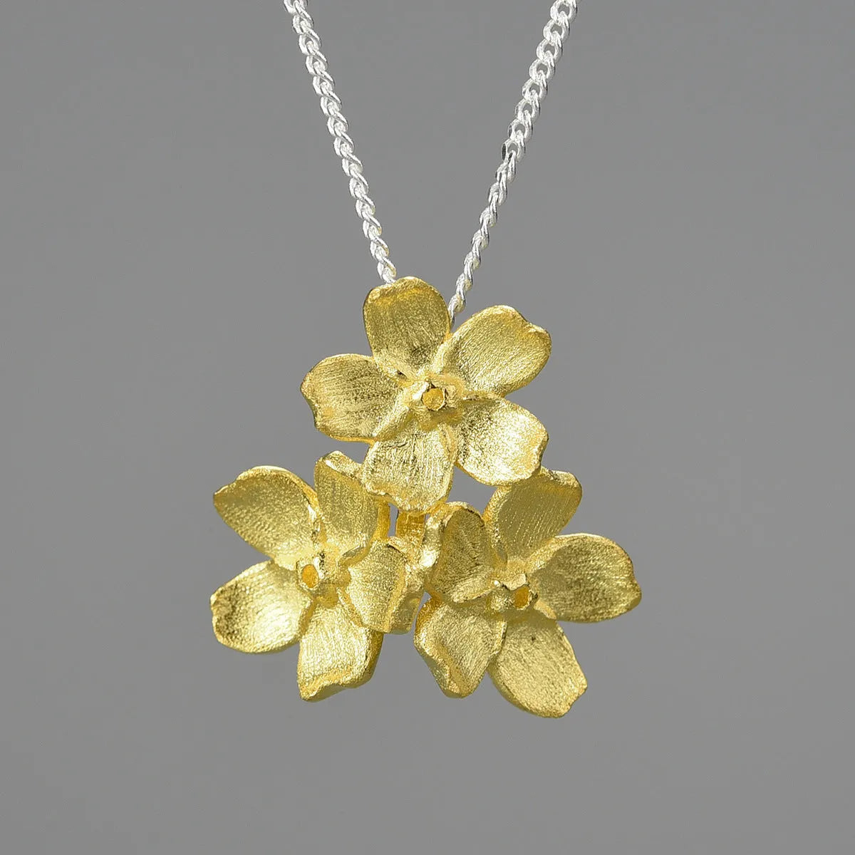 Sterling silver forget-me-not flower pendant in pastoral style with electroplated finish