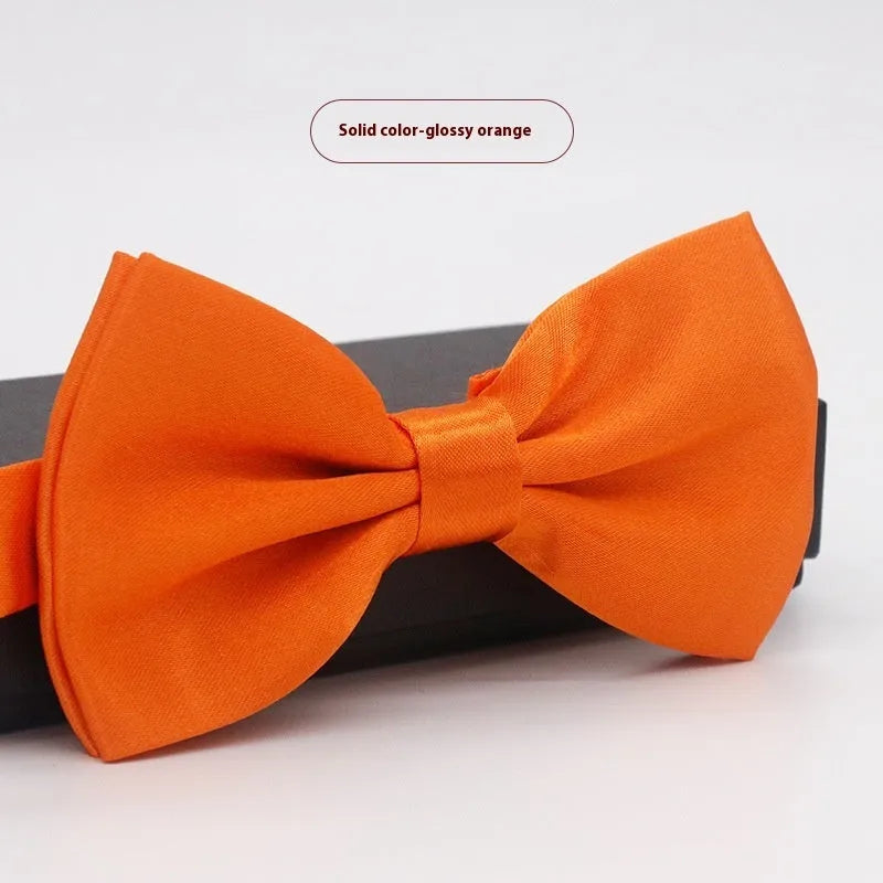 Solid colour polyester bow tie with flat head design measuring 12cm by 6cm