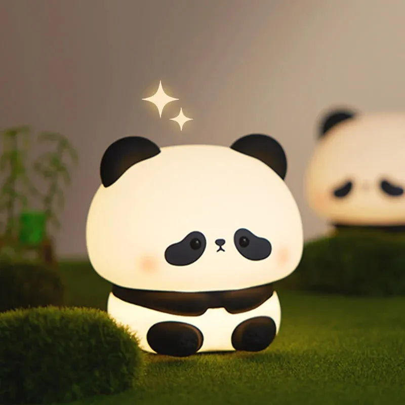Panda LED night light with soft silicone head, USB rechargeable, touch control, colourful lights, on a bedside table