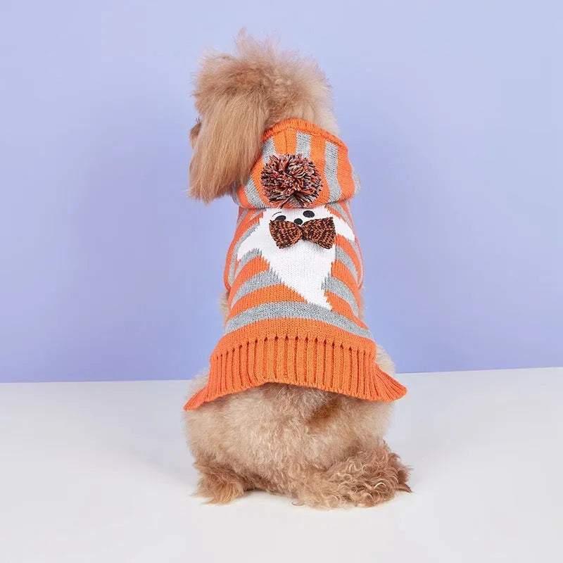 Orange striped knitted Halloween pet sweater with a hood and fur ball decoration for cats or small dogs.