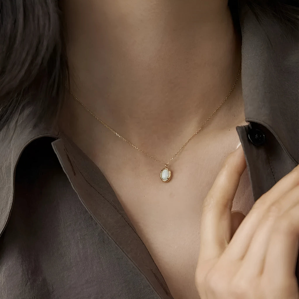 Geometric oval jelly opal pendant necklace in S925 silver with gold or white gold plating.