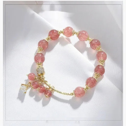 Pink adjustable women's bracelet with heart-shaped strawberry quartz crystal and freshwater pearl accents