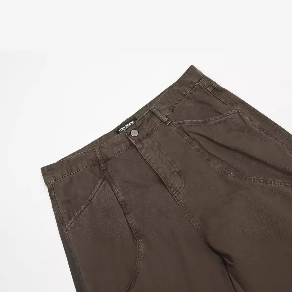 Man wearing brown loose fit high-waist straight leg cotton jeans trousers
