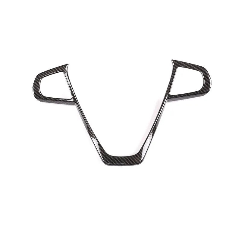 BMW steering wheel button frame decorative trim in black carbon fibre pattern.